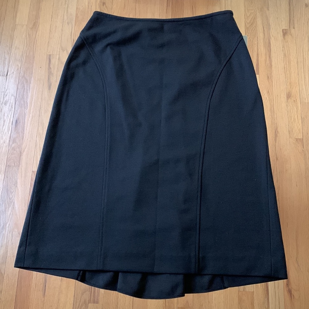 Black washable skirt with slight fishtail hem, size P8. NWT